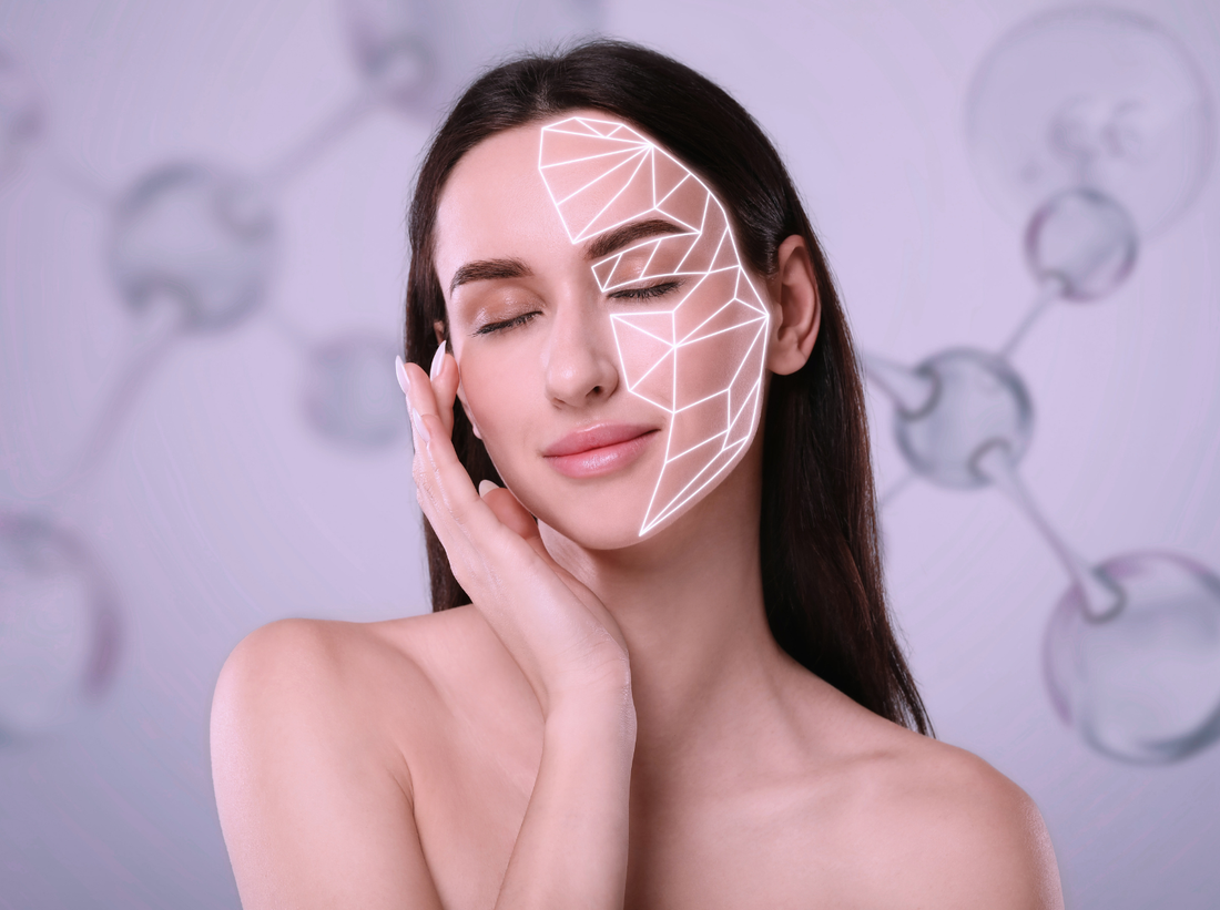 Woman with flawless skin gently touching her face, eyes closed, and geometric lines highlighting facial structure, symbolizing skincare, collagen, and beauty technology on a molecular background.